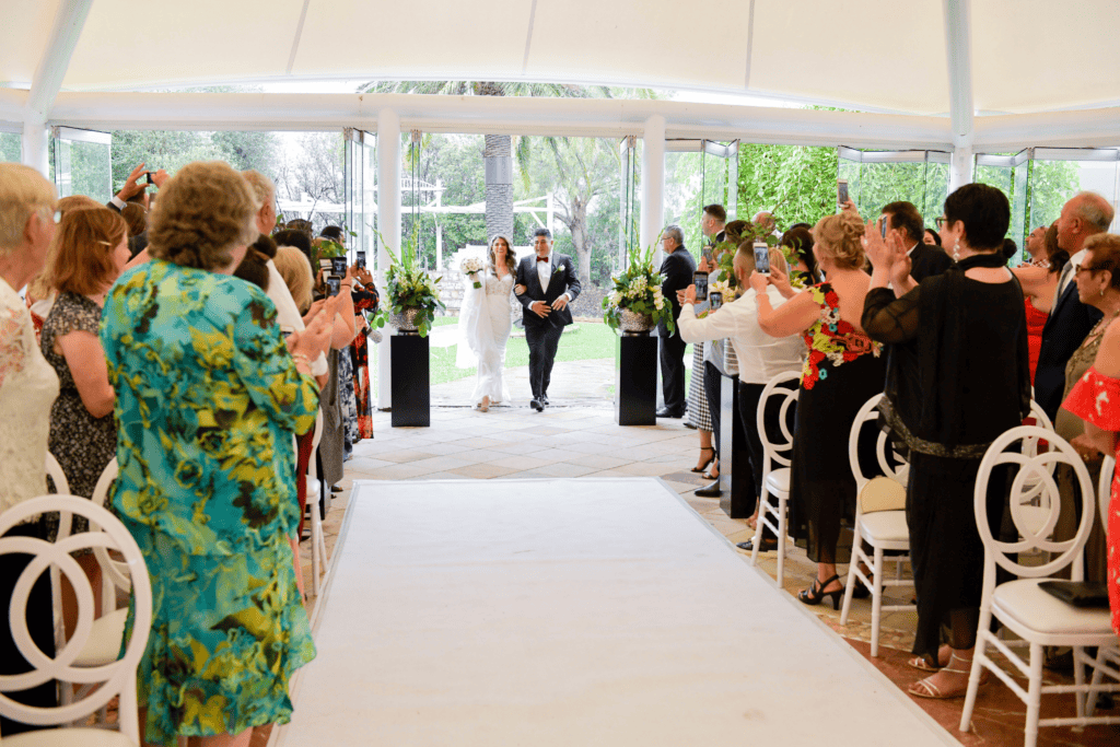 1 bride being walked down aisle by father at Melbourne wedding