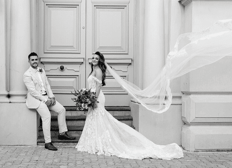 black and white photo of bride and groom posing for wedding photographer in Fremantle