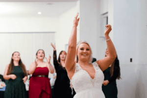 bouquet toss photographed at same sex wedding in NSW