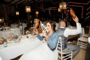 Bride and groom playing shoe game at cedar creek wedding