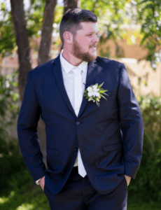 Groom posing before ceremony