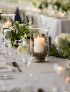 candles and greenery reception table setting
