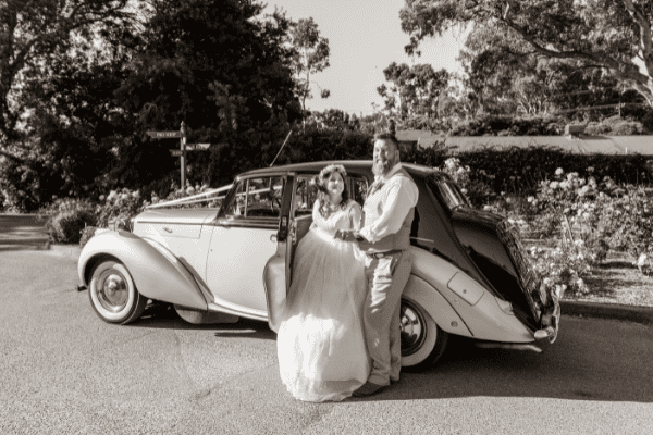 bride and groom getting out of wedding car in Adelaide, South Australia