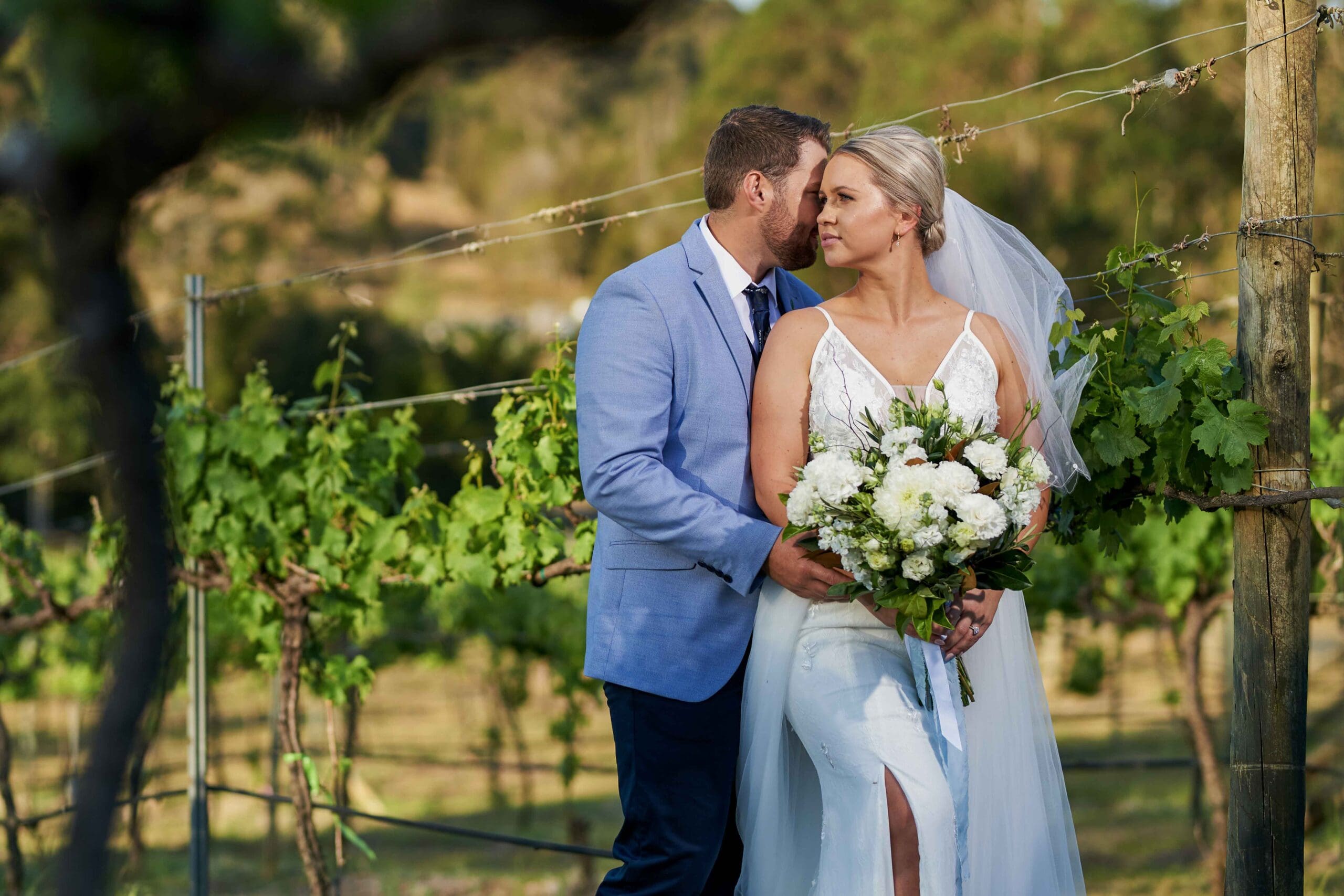 Bride and groom posing for wedding photographer in Gold Coast