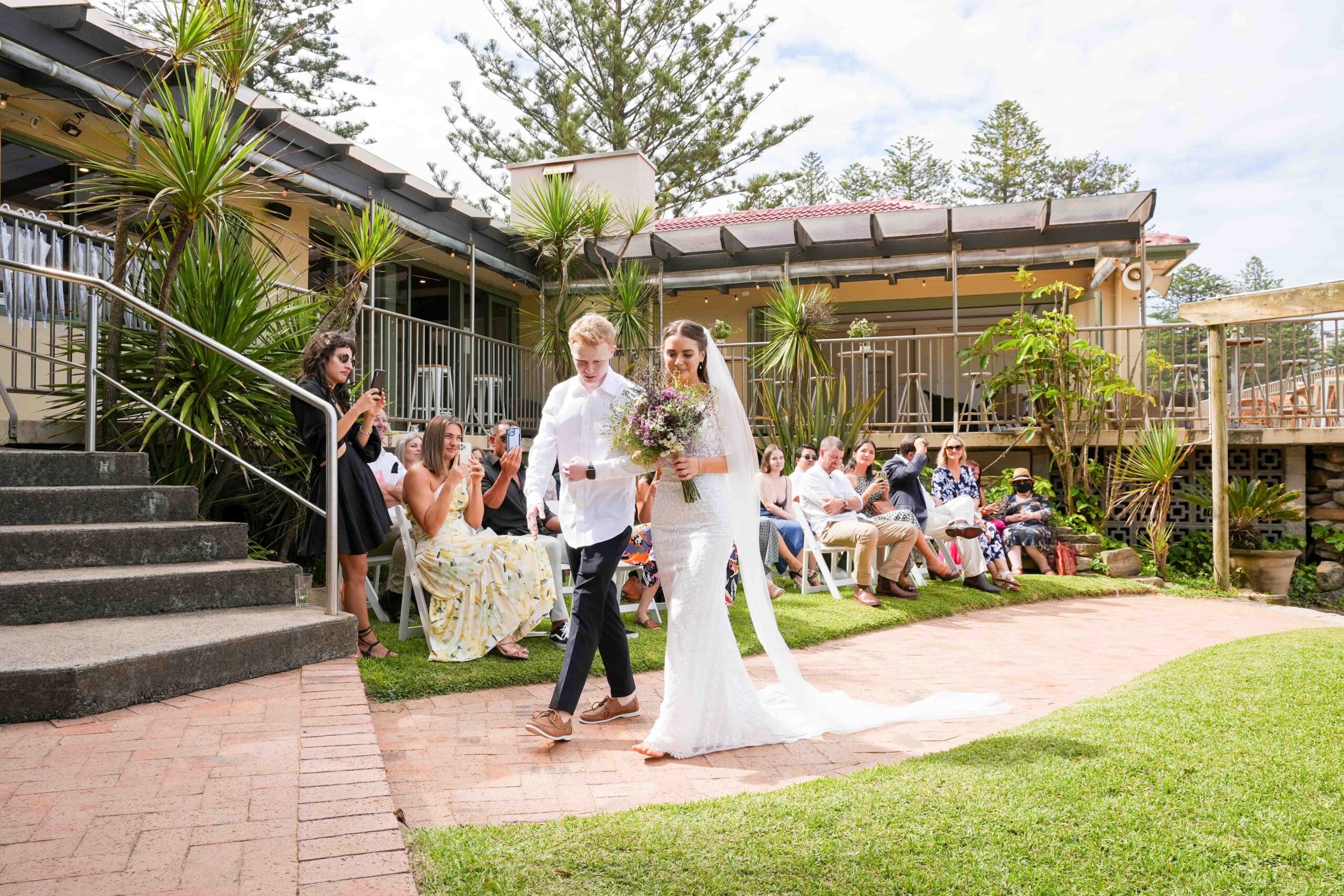 bride walking down aisle at Bilgola beach wedding