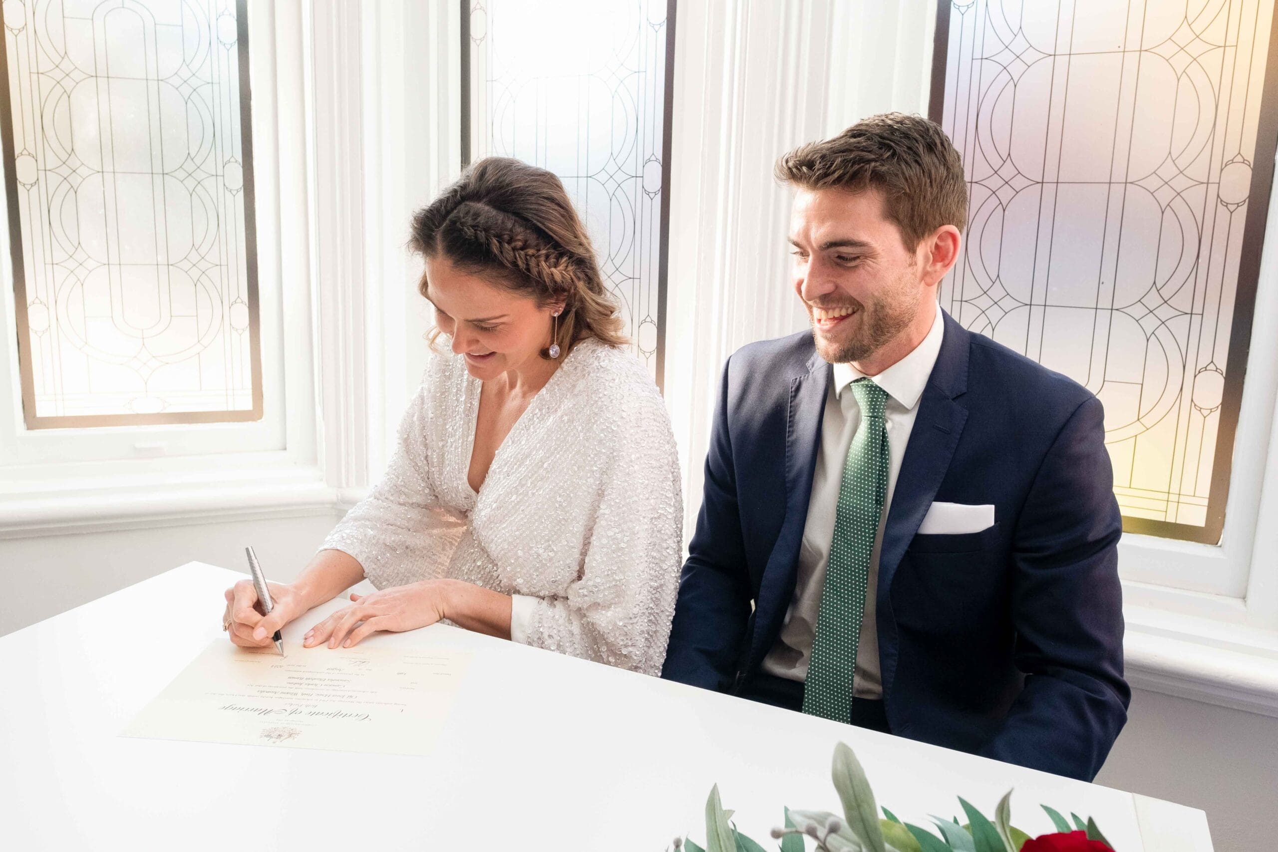 couple signing marriage papers at Perth Registry Office