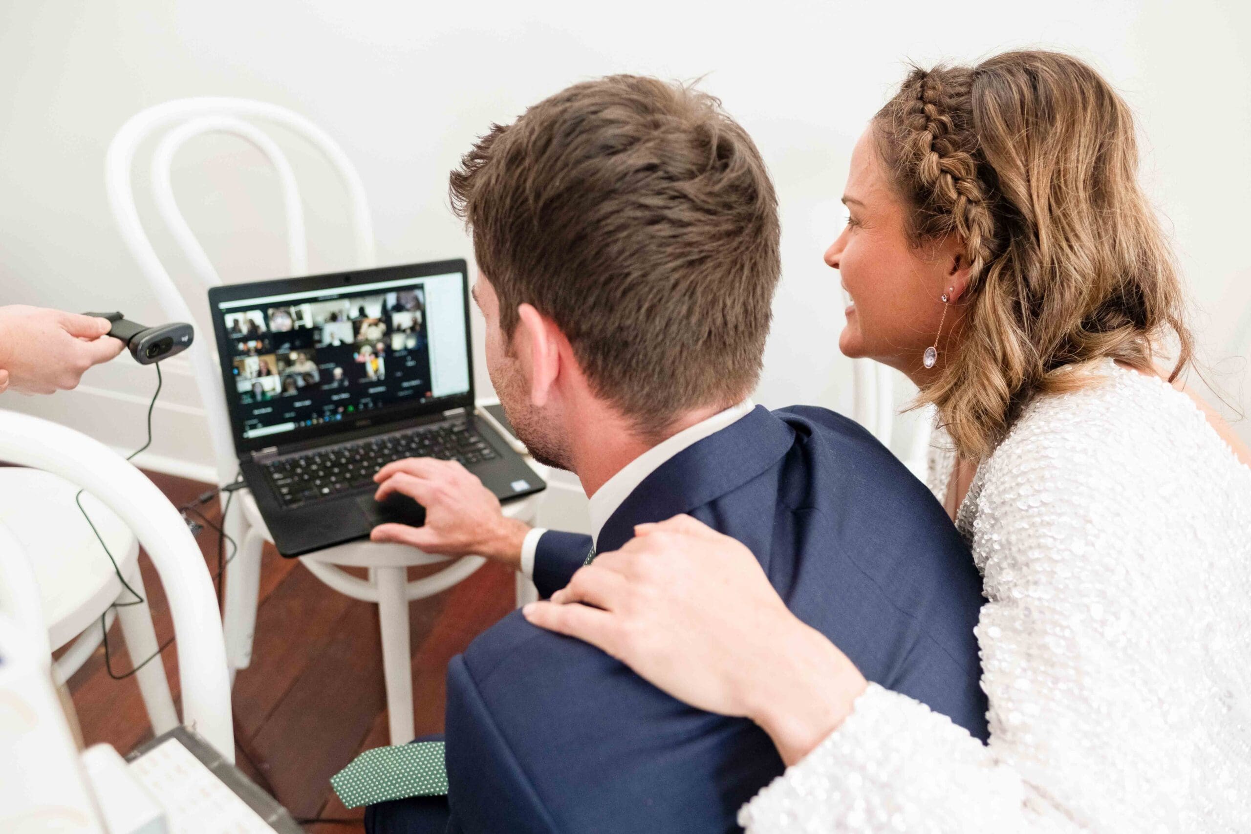 bride and groom livestreaming wedding in Perth