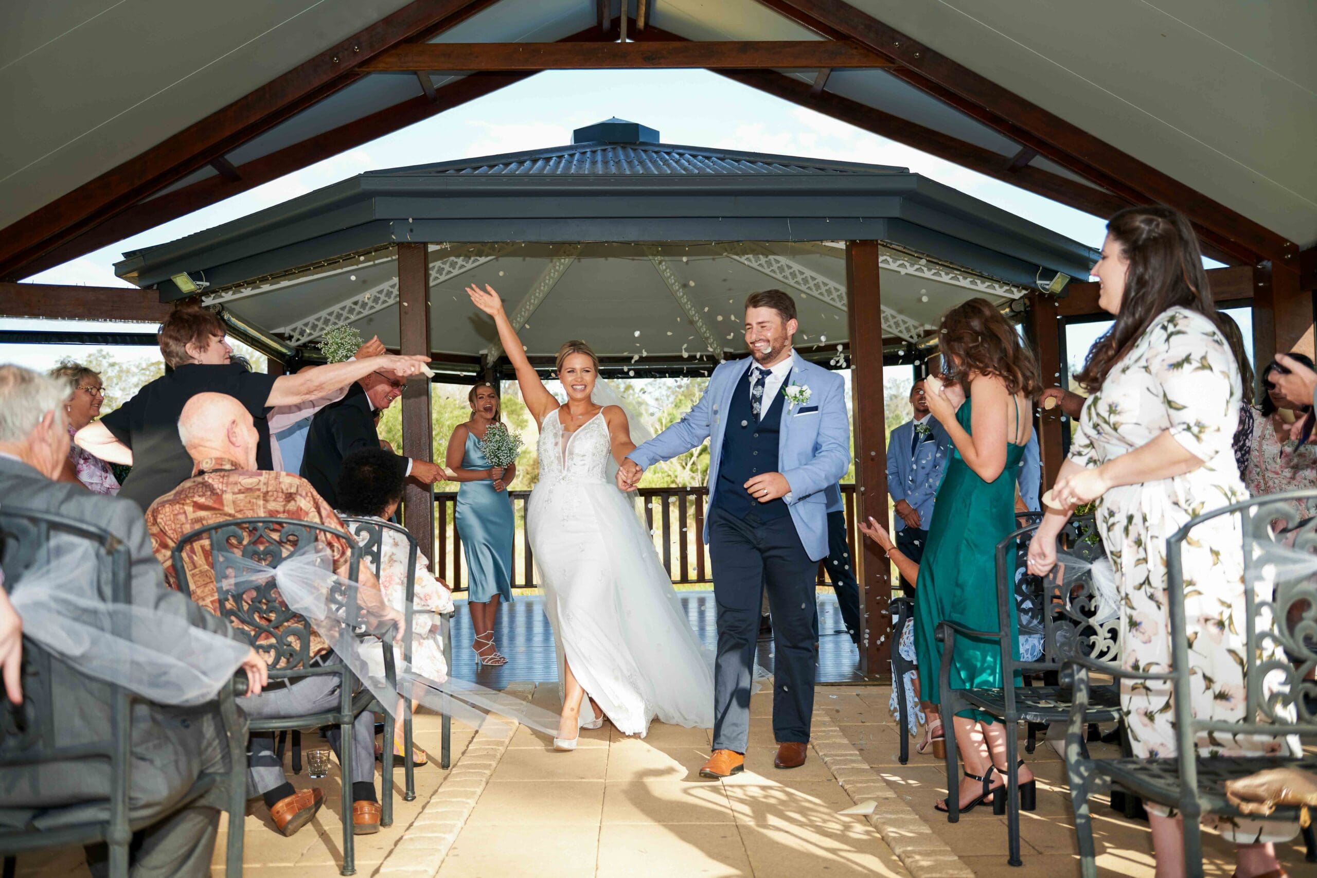 bride and groom walking down aisle after wedding ceremony in Brisbane