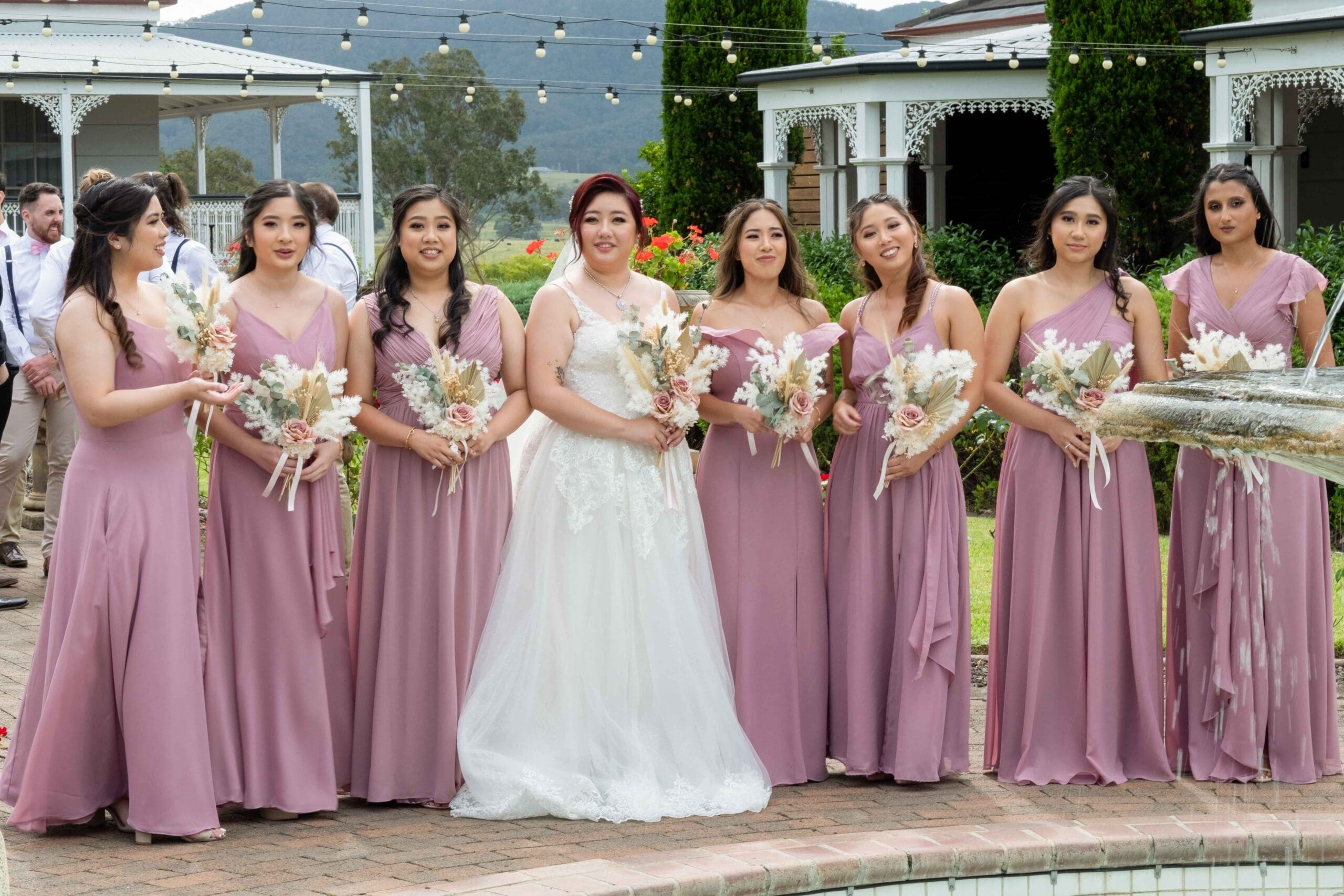 bridal party posing for wedding photos
