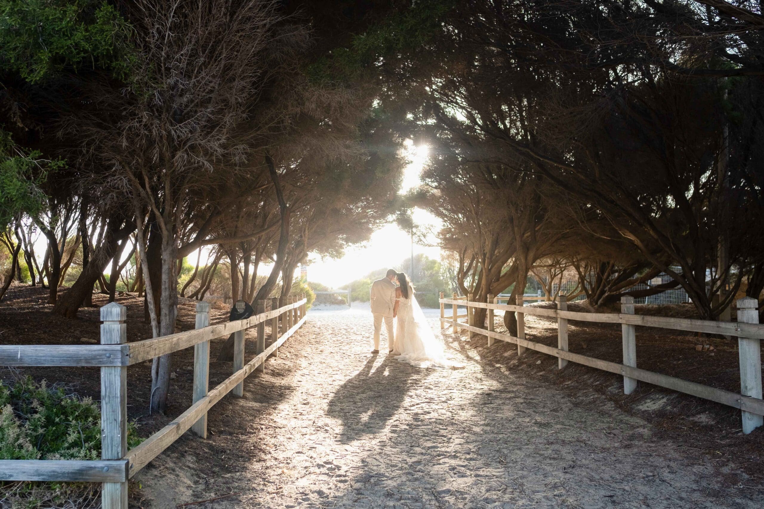 bride and groom on Fremantle beach after Perth wedding