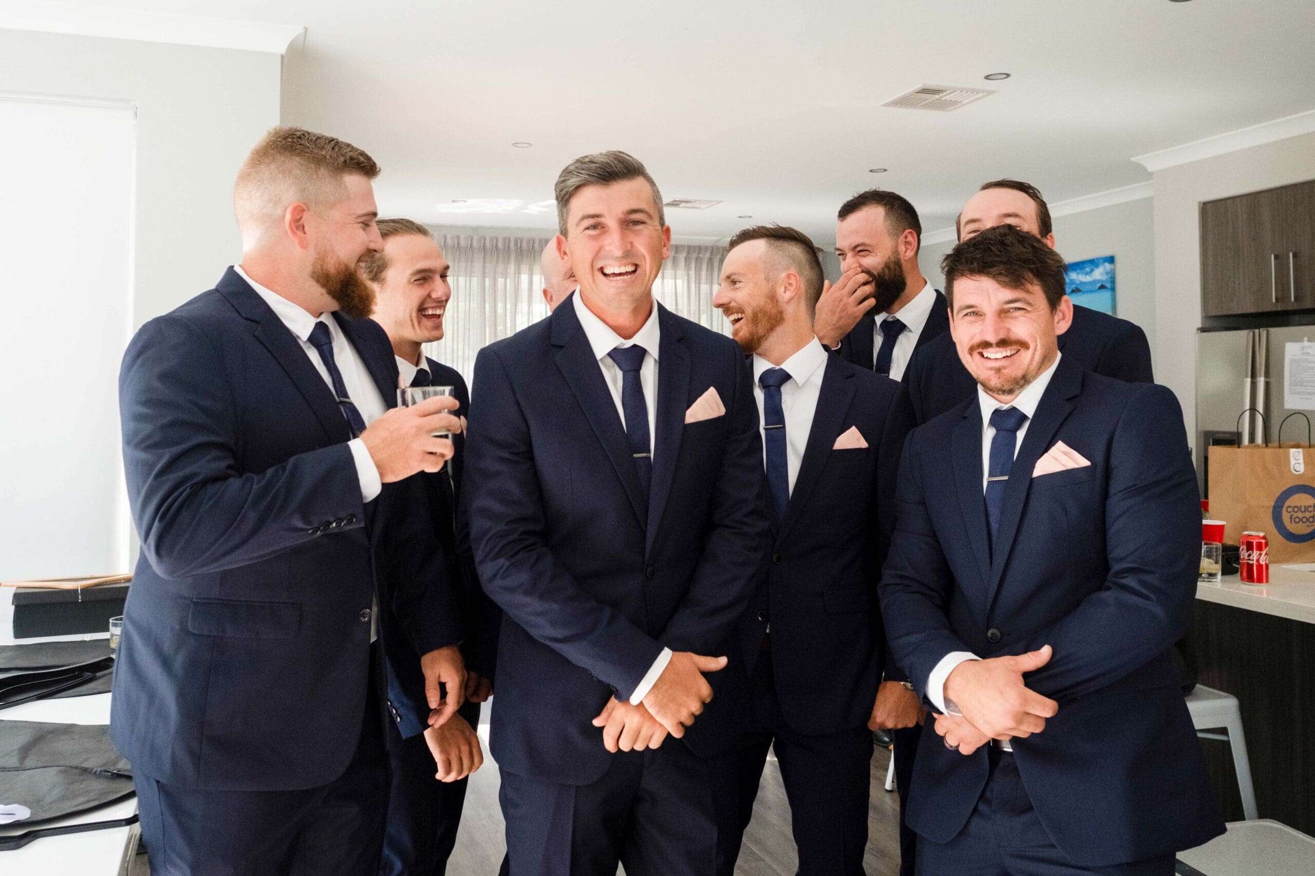 groom and groomsmen posing for wedding photographer in Perth