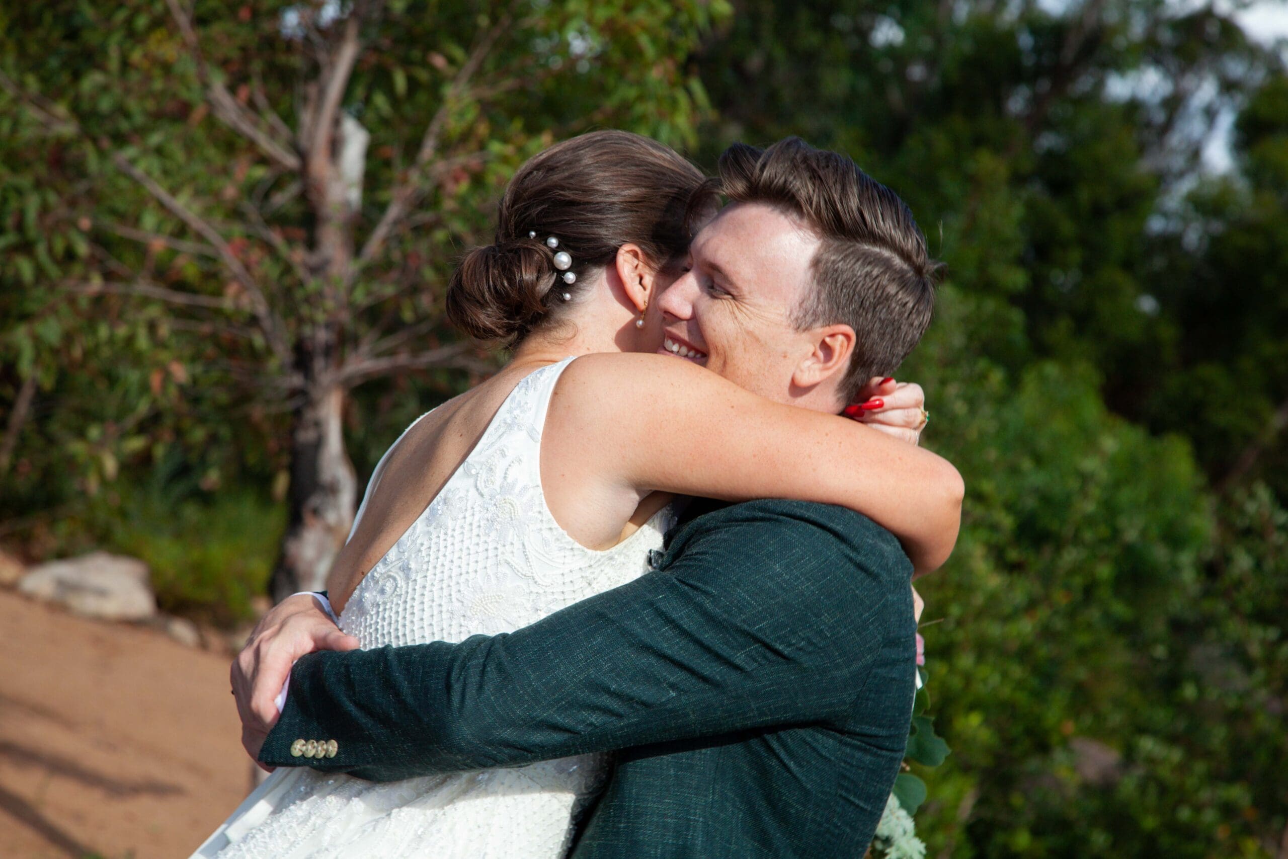 bride and groom hugging at Canberra wedding