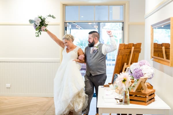 bride and groom walking into Sydney reception