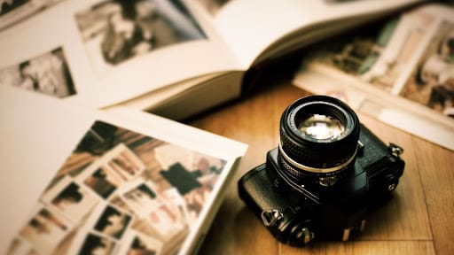 Camera surrounded by photos