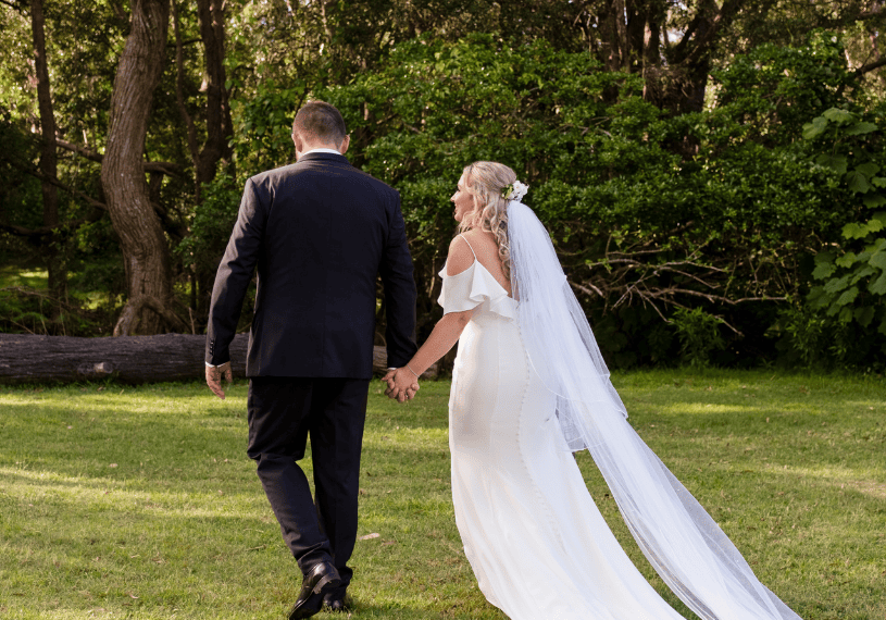 Bride and groom holding hands - Sublime Point Lookout Wollongong