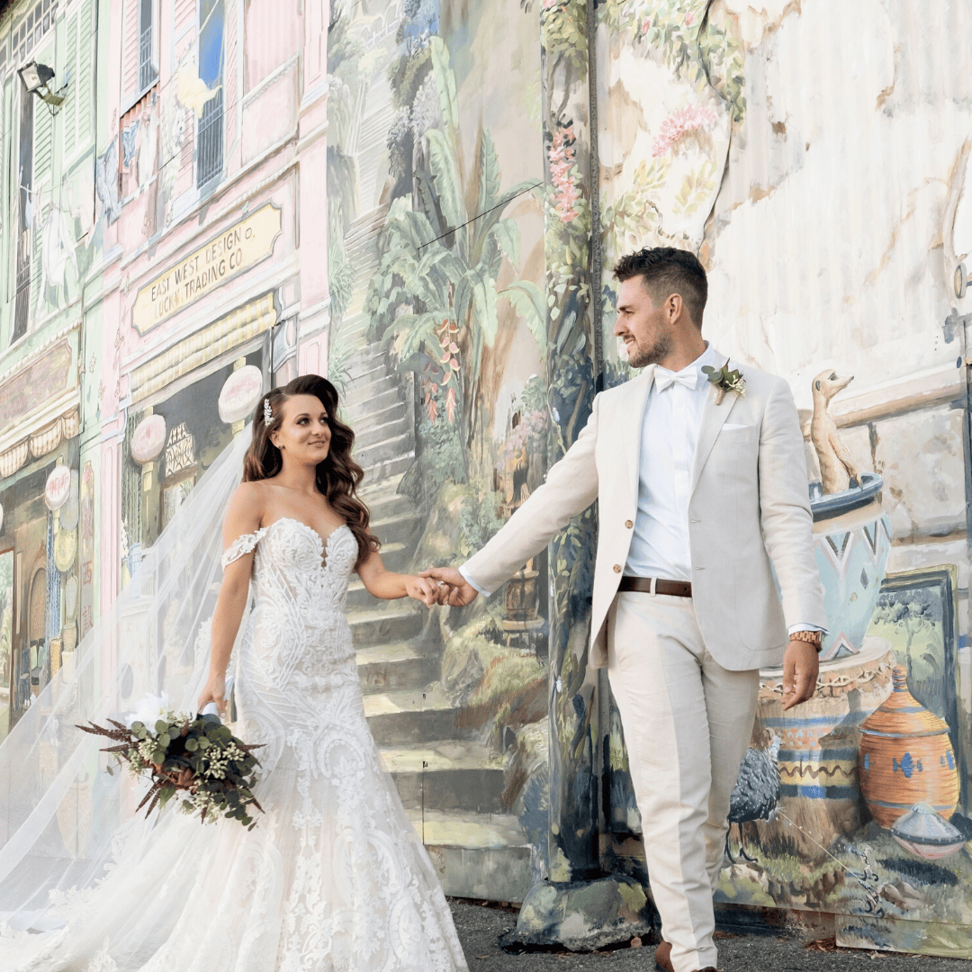 square cropped photo of bride and groom walking in Fremantle after wedding