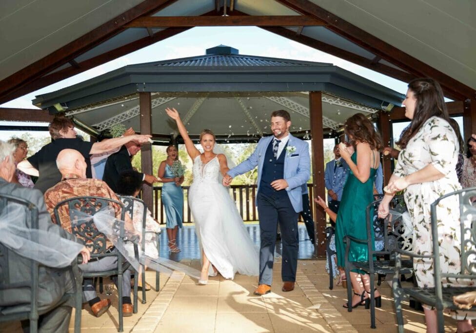 bride and groom walking down aisle after wedding ceremony in Brisbane