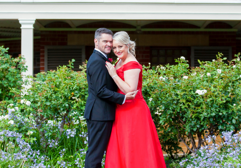 1 Bride in red dress hugging groom Adelaide wedding